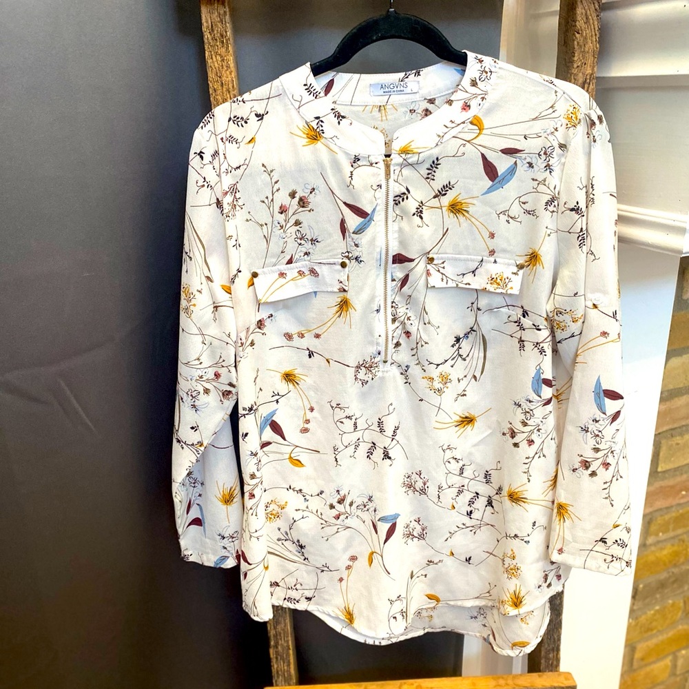 Beautiful boutique blouse with gold detail.